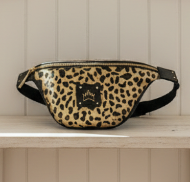 Leopard print fanny pack with a brand logo on a white background