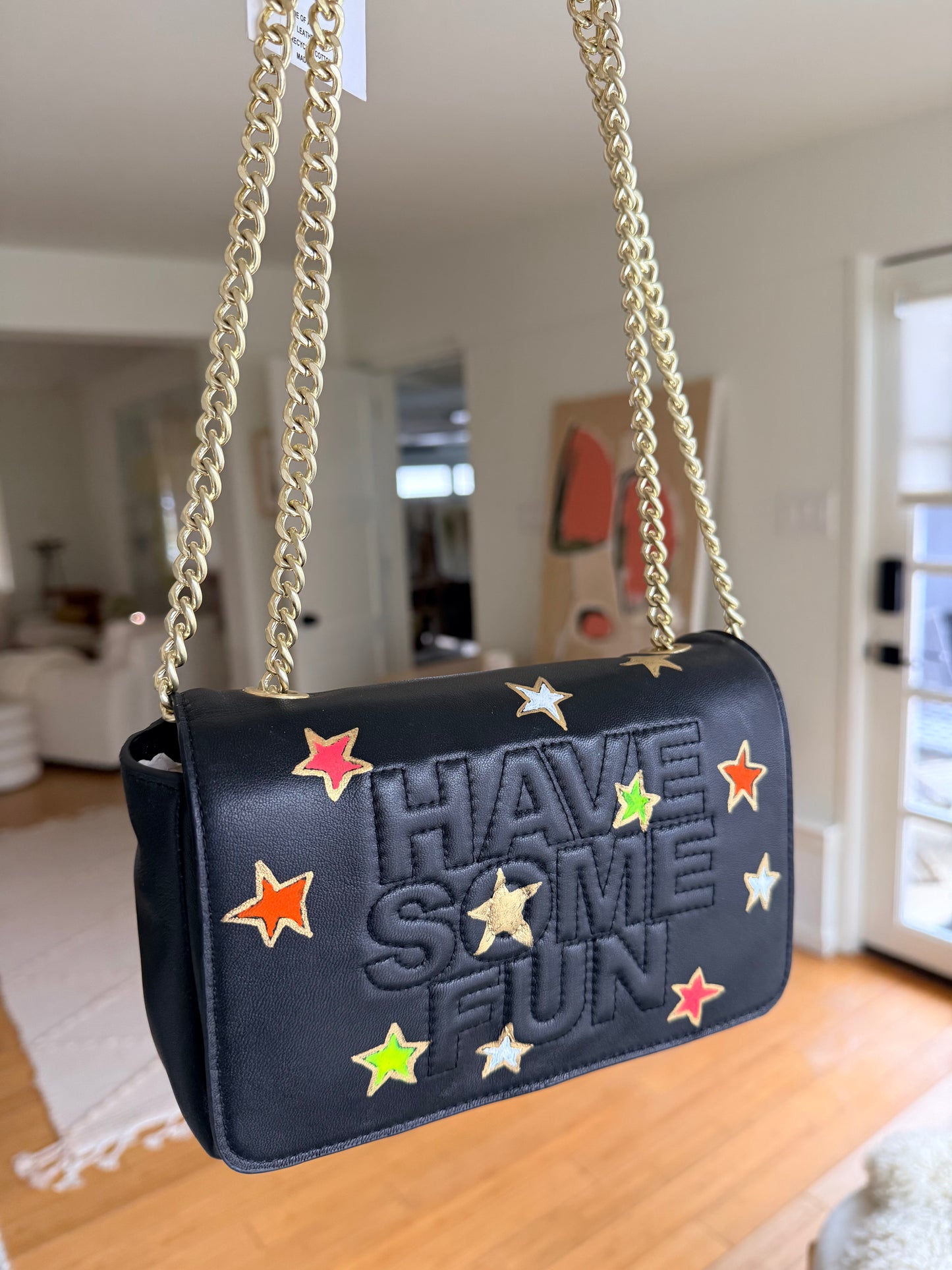 The Black Gabrielle Bag with Multi-Colored Neon Filled Gold Stars - hand painted by Stephanie Rado Taormina