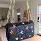 The Black Gabrielle Bag with Multi-Colored Neon Filled Gold Stars  - hand painted by Stephanie Rado Taormina